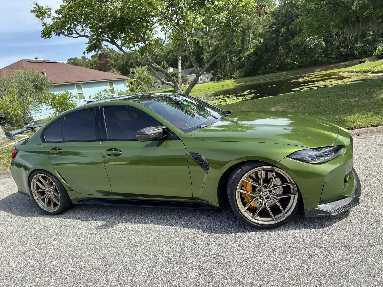 BMW sedan wrapped in matte military green