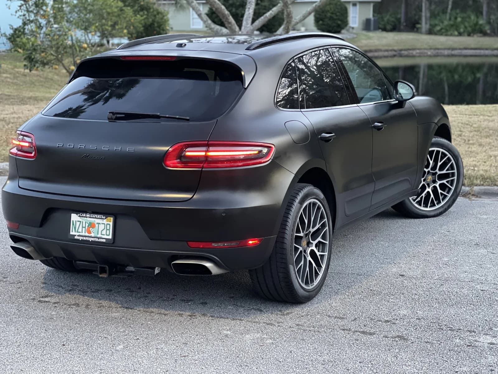 Rear of a Porsche Macan wrapped in matte black