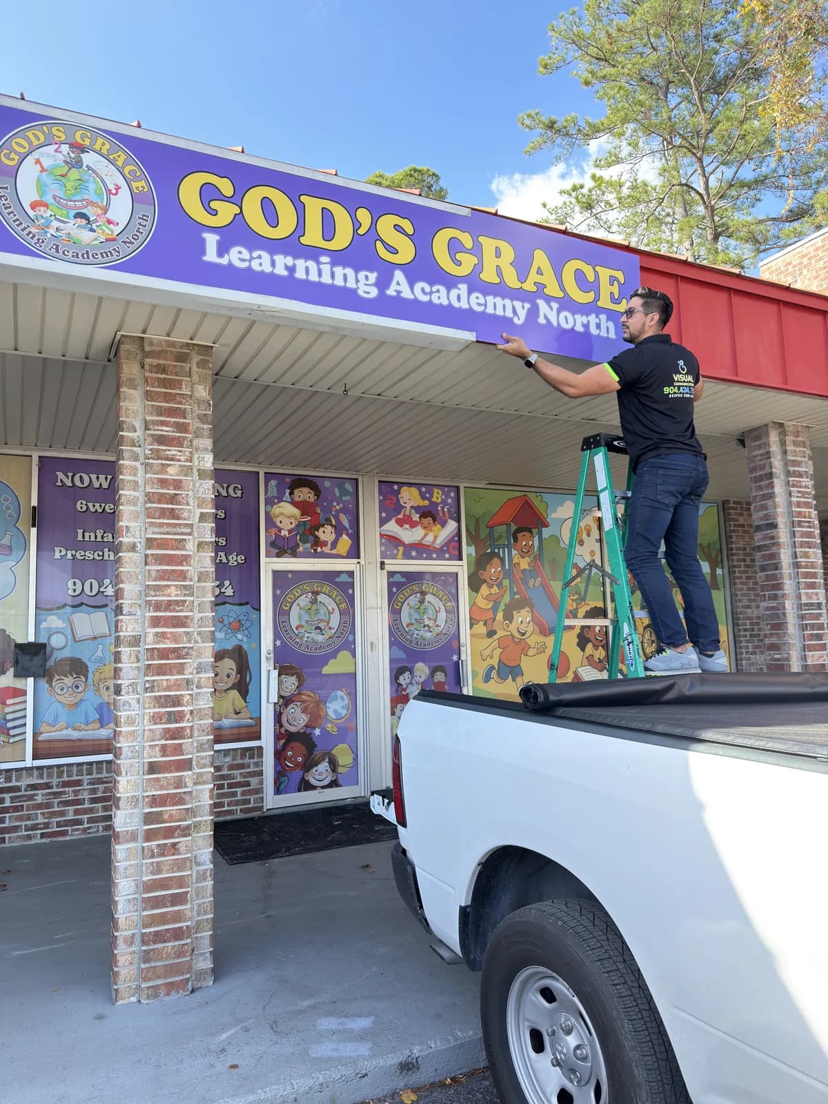 Storefront banner installed above a learning academy