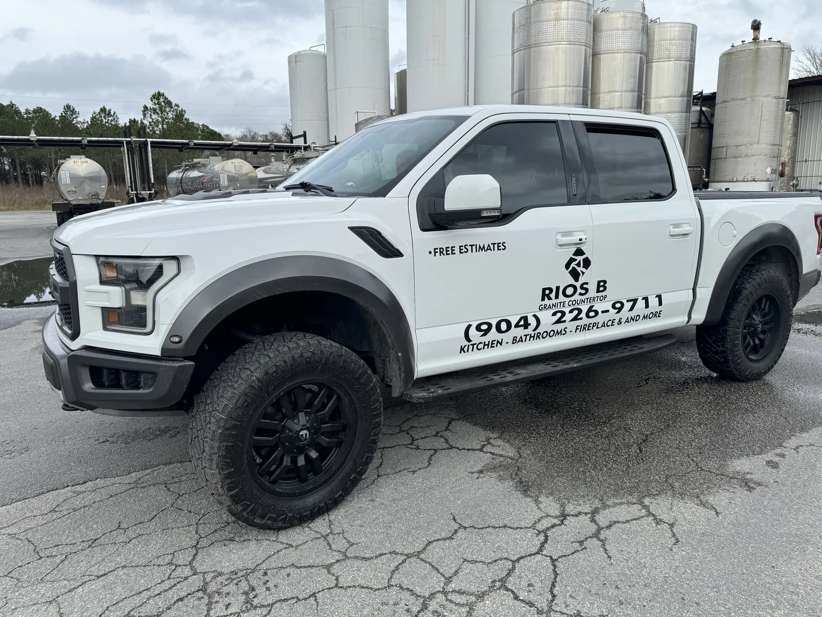 Pickup truck with door decals for a contractor