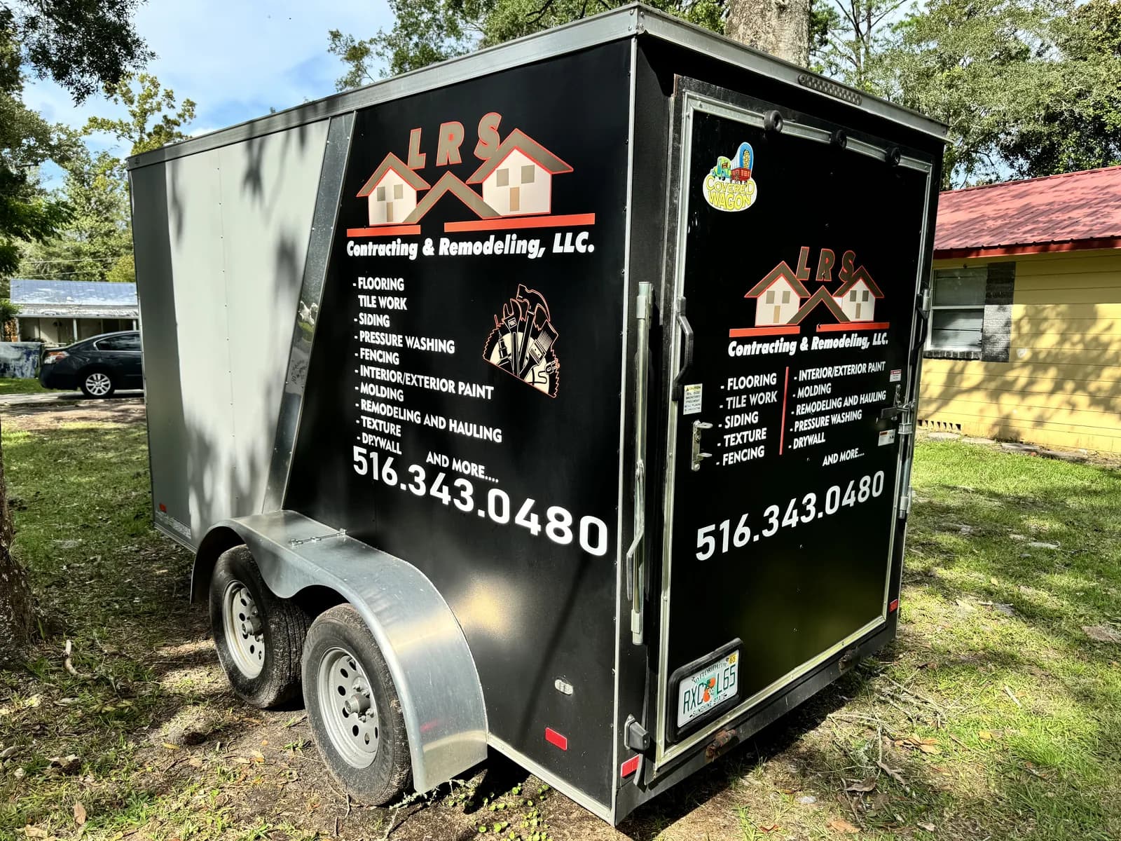 Enclosed trailer with a full wrap for a remodeling contractor