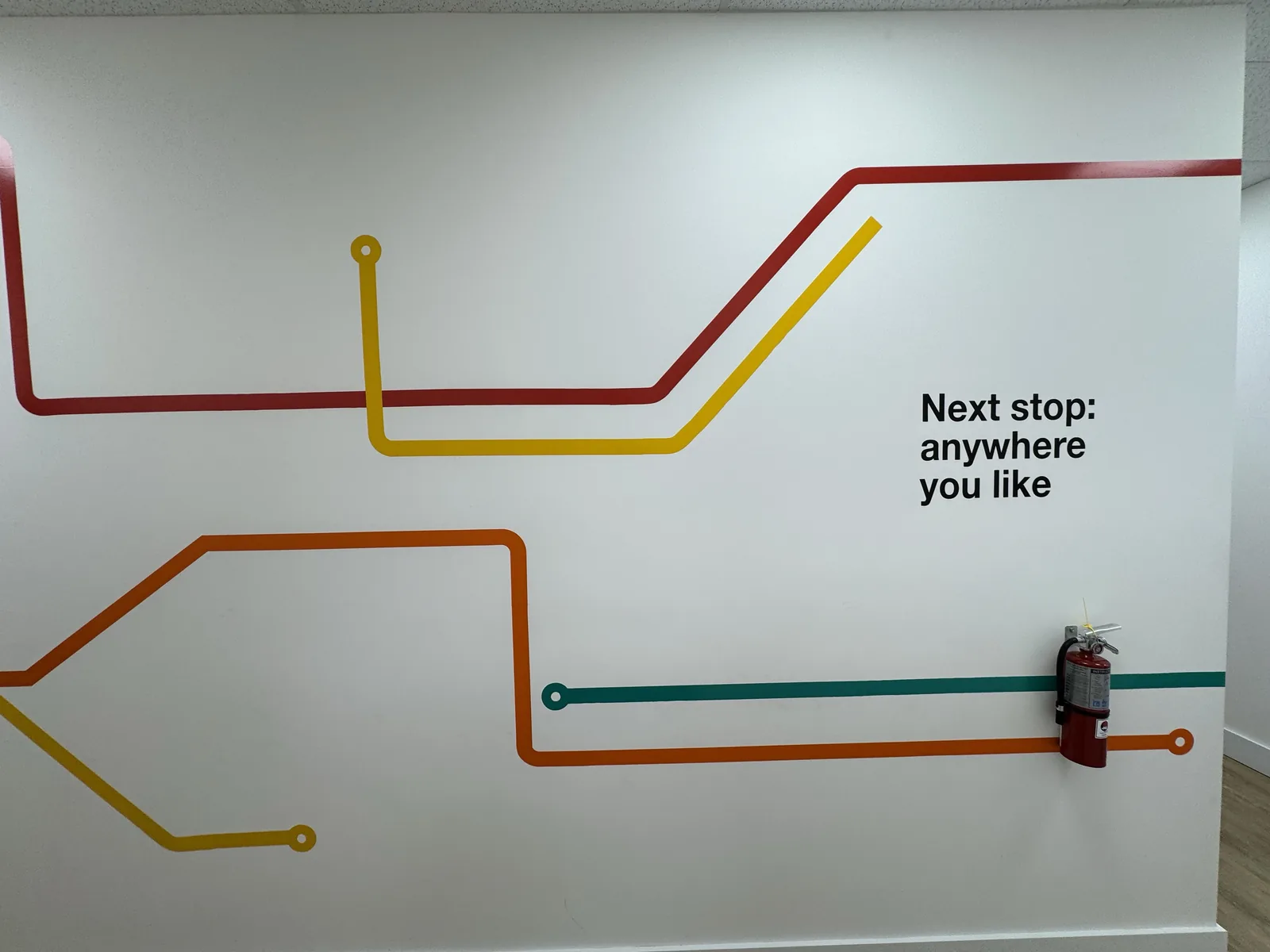 Subway-style line graphic printed across an interior wall