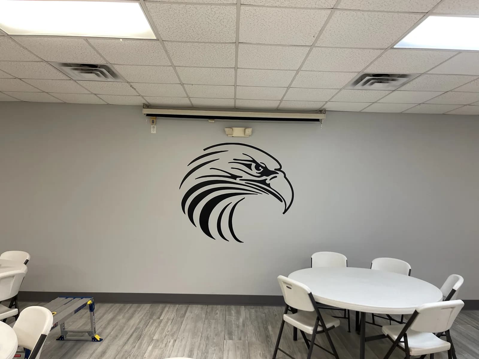 Meeting room with a mascot graphic printed on the wall
