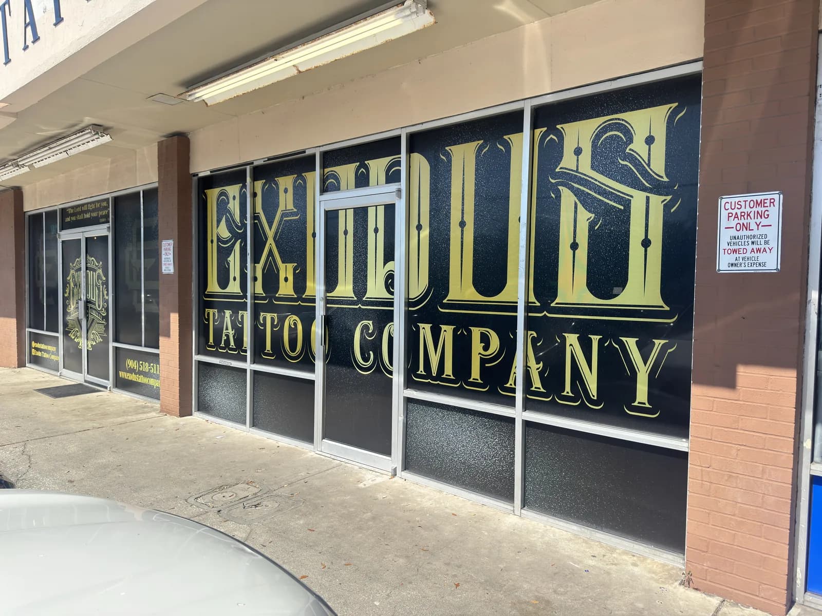 Large window lettering across the front of a paint company