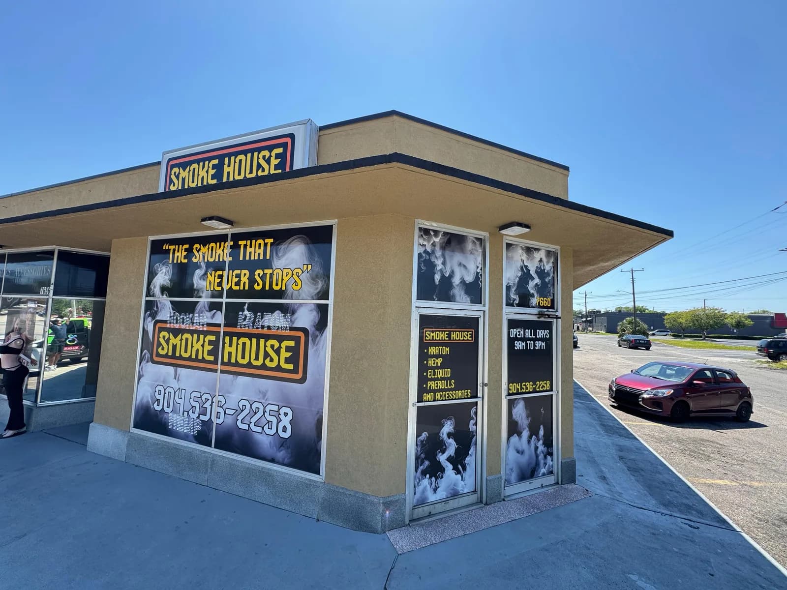 Smoke house restaurant with printed graphics across every storefront window